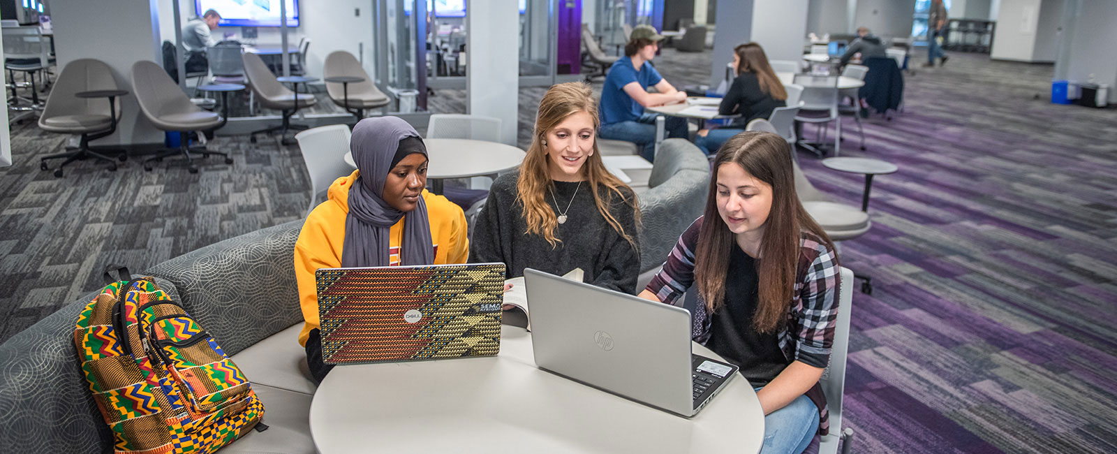 Three female students studying together.