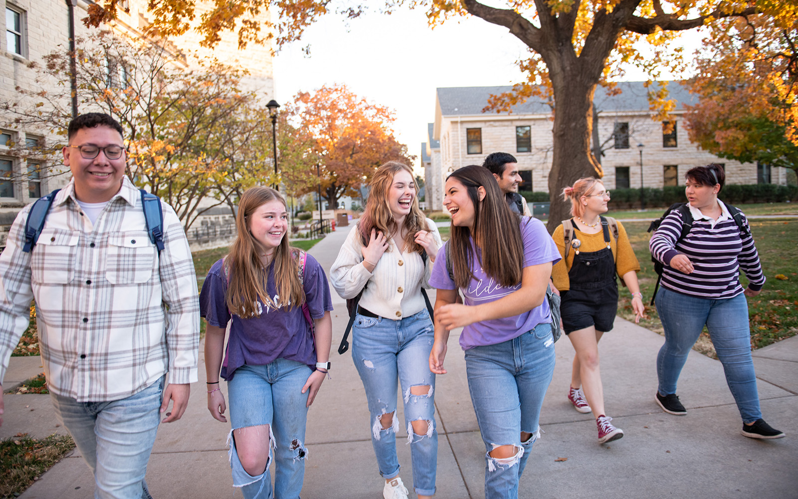 Students walking on campus during the fall